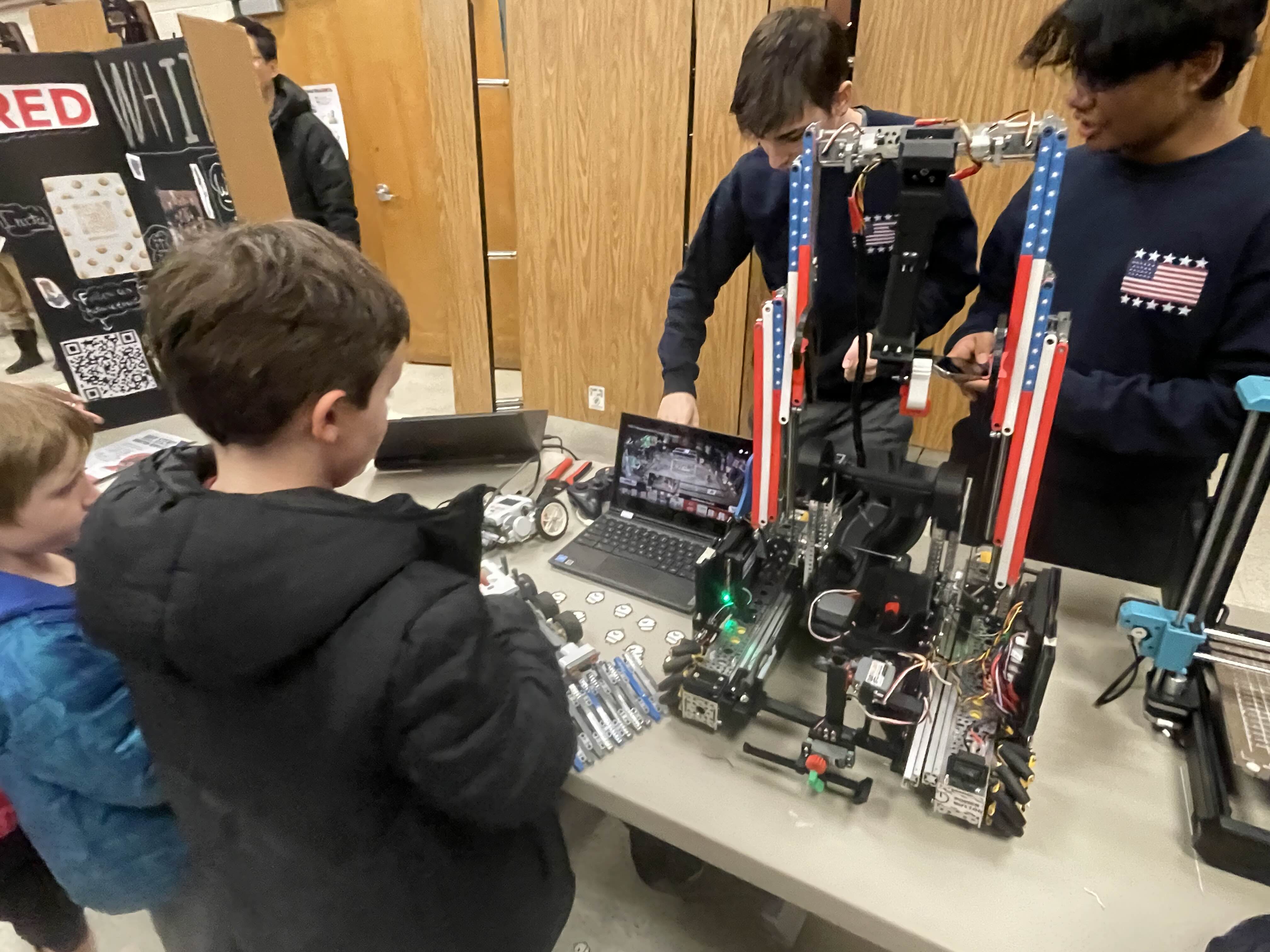 Outreach event: live robot demo and team engagement.